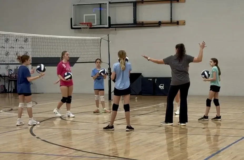 Coach Lisa coaching a volleyball clinic in Fuquay-Varina, NC